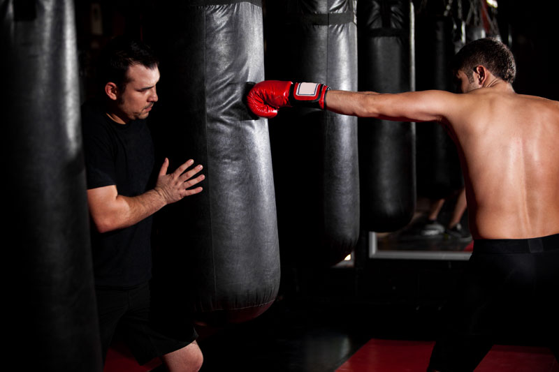man boxing with bag