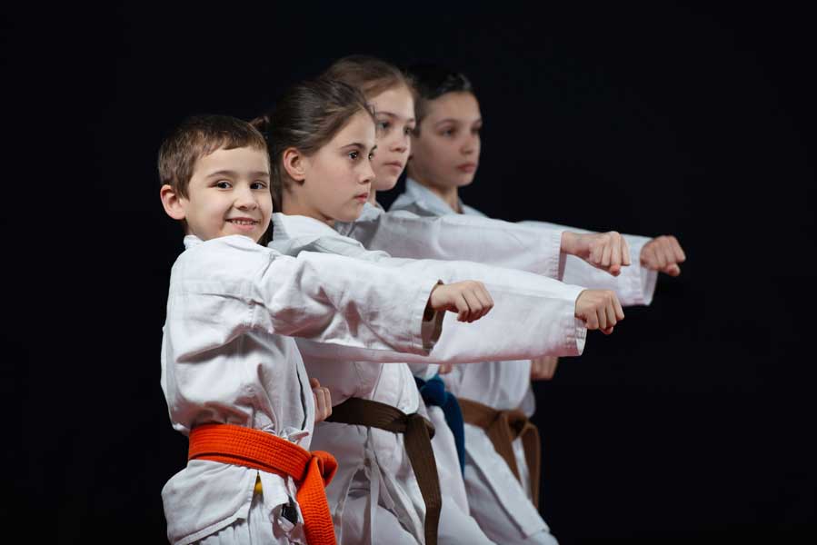 group of kids punching