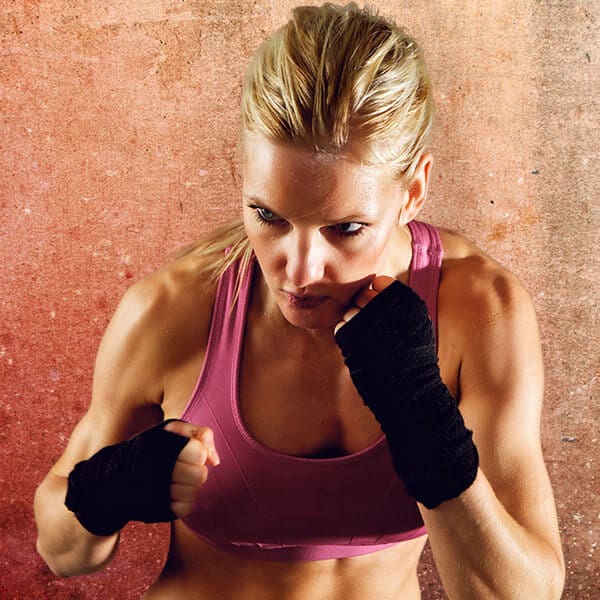 Mixed Martial Arts Lessons for Adults in __CITY__ __STATE__ - Lady Kickboxing Focused Background